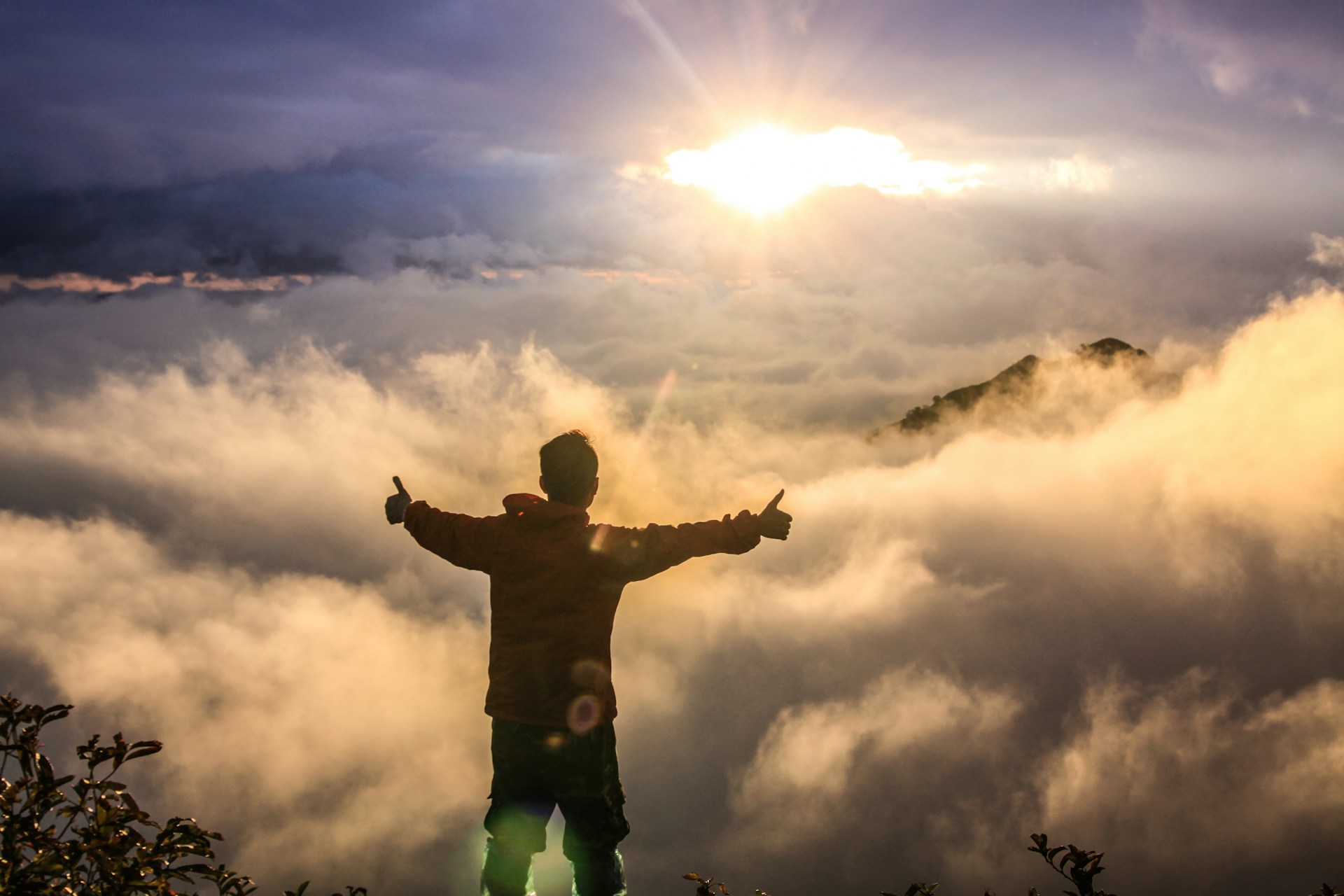 Man facing clouds golden time