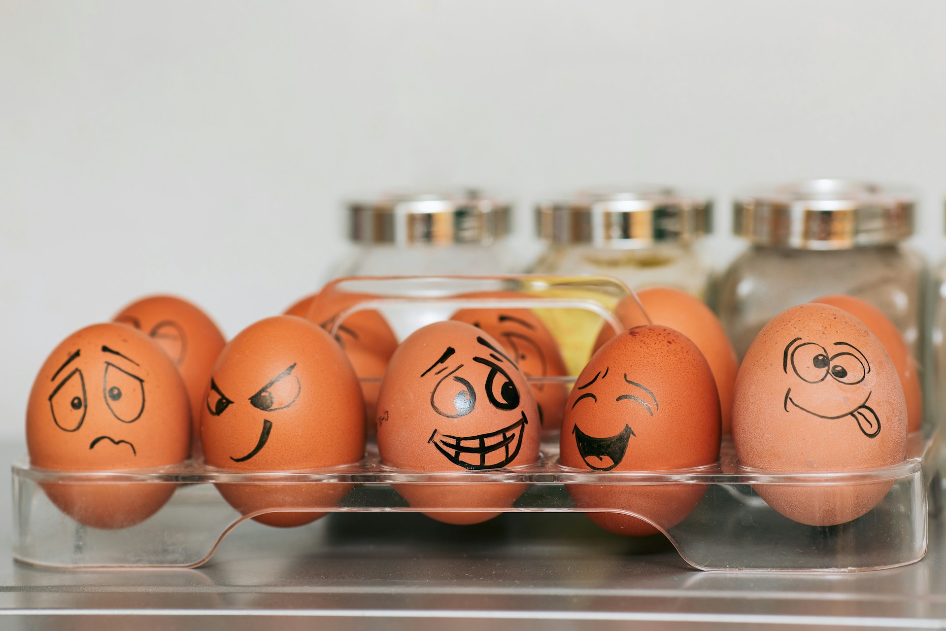 Orange white egg on stainless steel showing ego and emotions