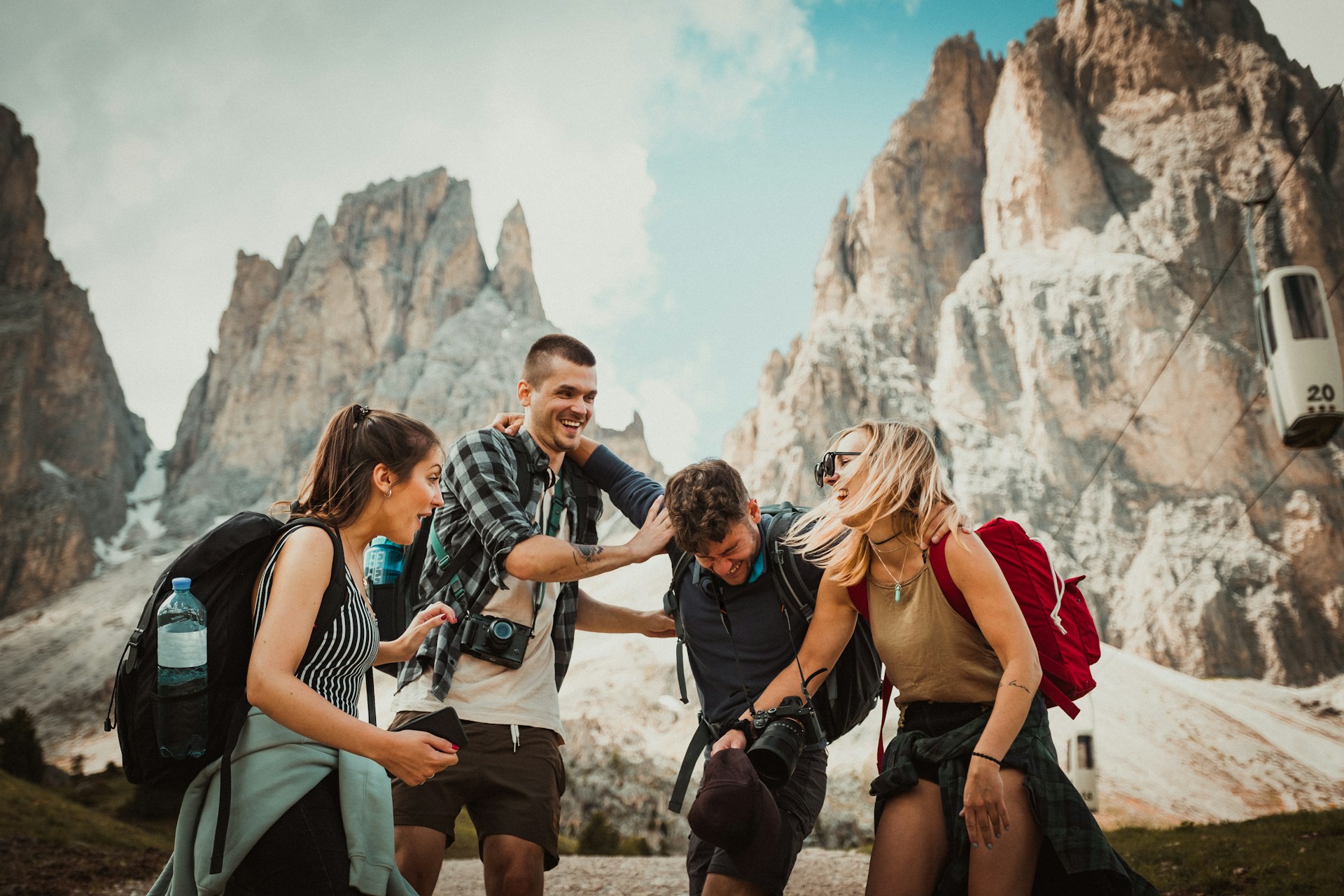 Two men playing with two women