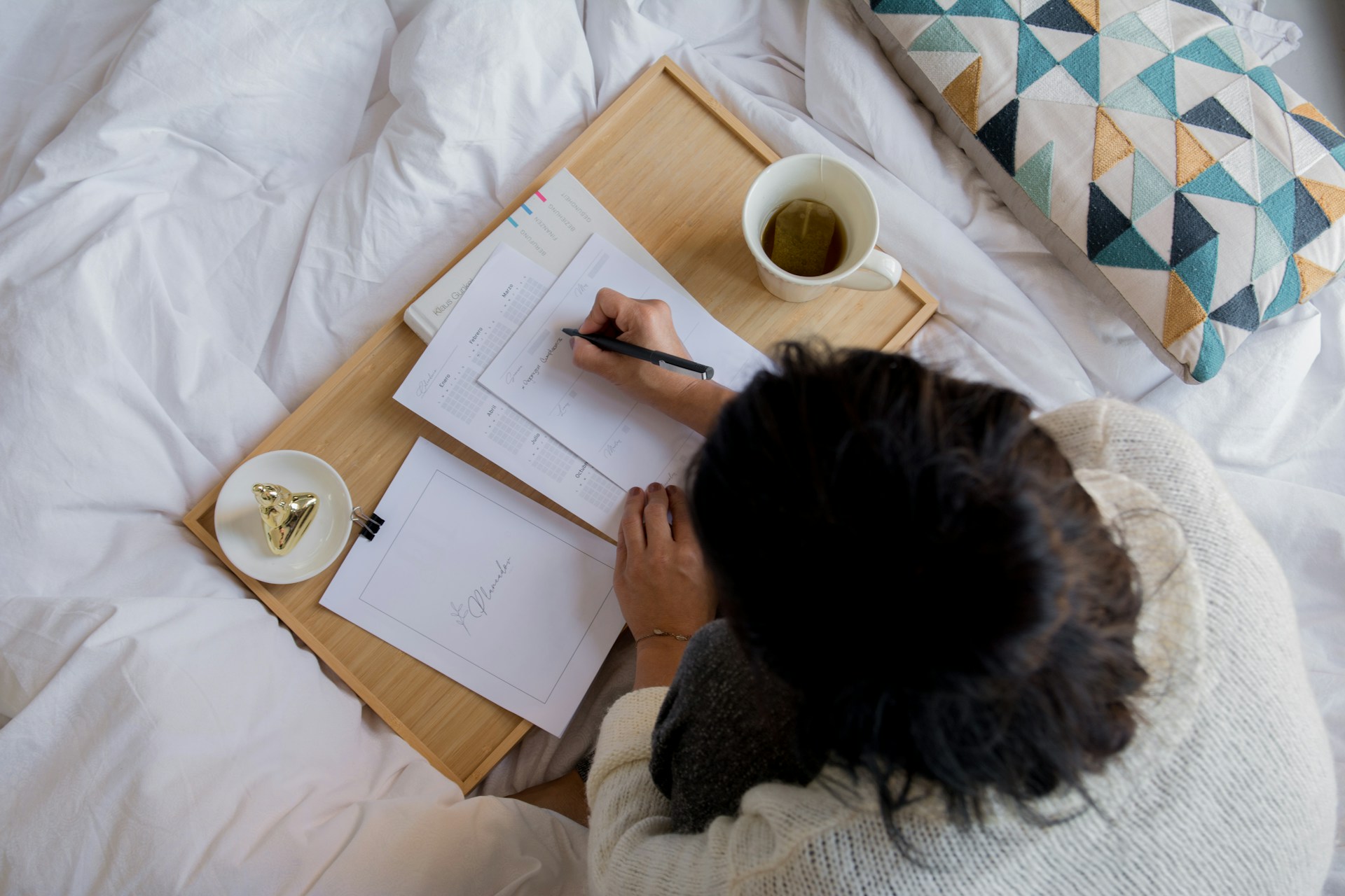Writing on paper with mug