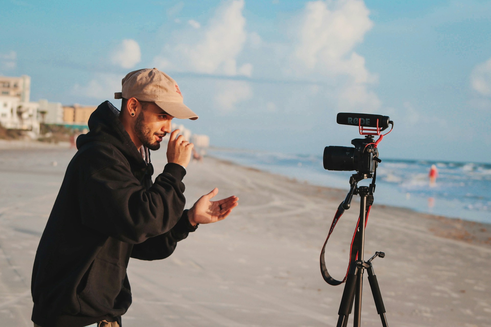 Man in black jacket with camera