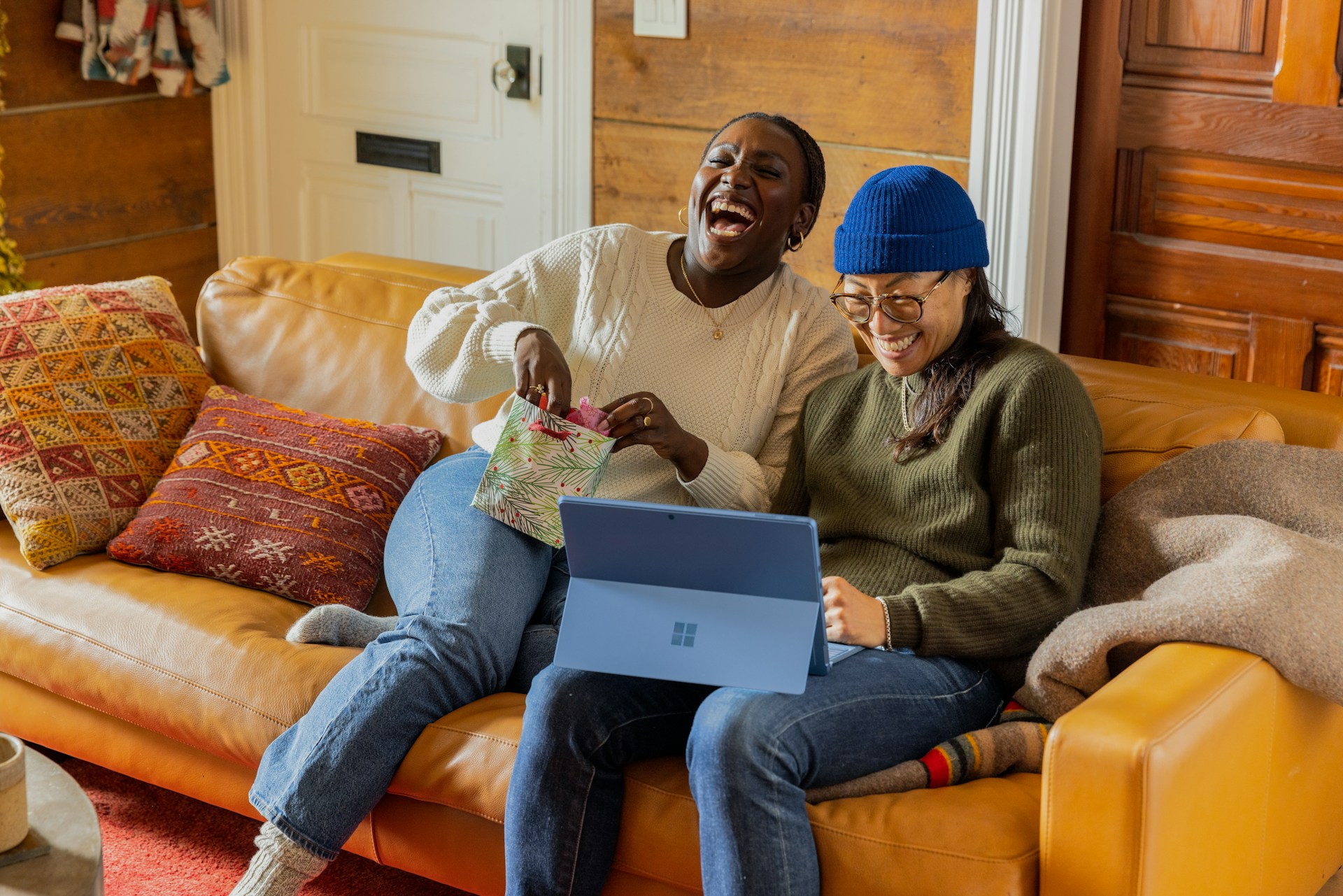 Person with laptop on couch